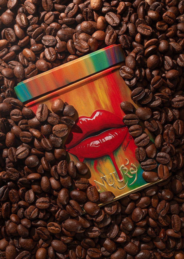 Moka Bliss artwork tin resting in coffee beans